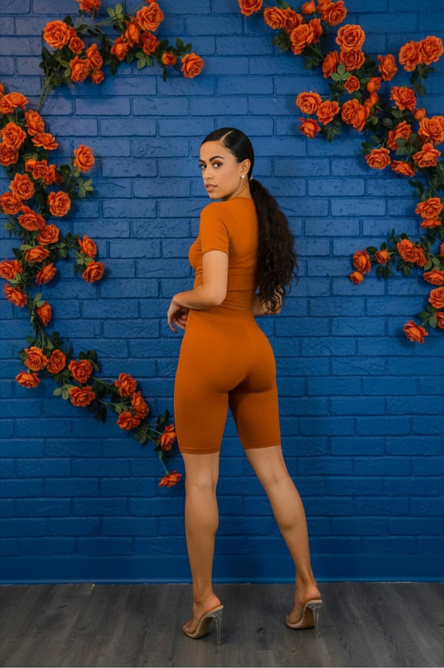Urbn-cart burnt orange microfiber biker short set with short sleeve crop top and high-waisted shorts.