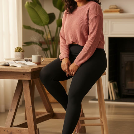 Urbn-cart black high-rise 7/8 length leggings with integrated cell phone pocket, made of poly/spandex jersey.