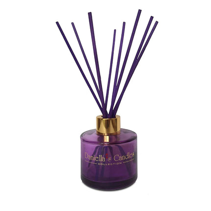 Urbn-cart purple glass reed diffuser with gold collar and purple reeds for home fragrance.