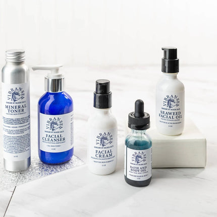 Urbn-cart Vibransea Skincare Gift Set with four bottles: mineral toner, facial cleanser, facial cream, and seaweed facial oil.
