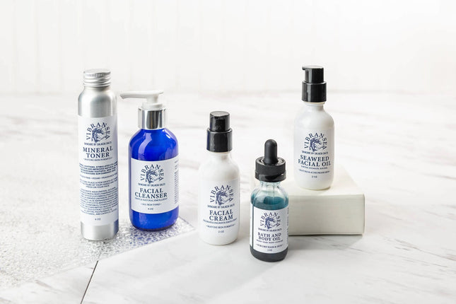 Urbn-cart Vibransea Skincare Gift Set with four bottles: mineral toner, facial cleanser, facial cream, and seaweed facial oil.