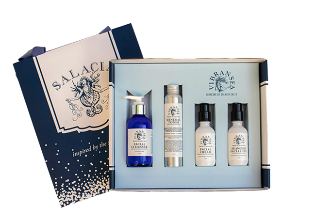 Urbn-cart Vibransea Skincare Gift Set with four products: facial cleanser, mineral toner, facial cream, and facial oil. Includes gift packaging.