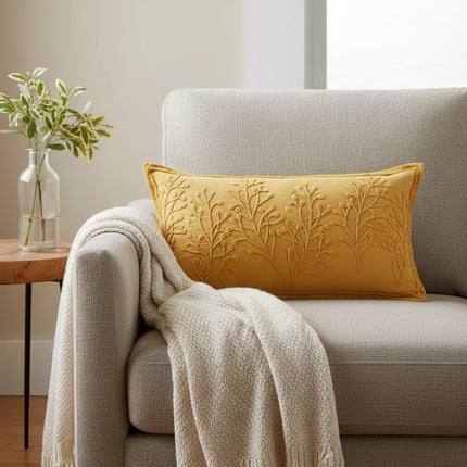 Urbn-cart yellow lumbar pillow with embroidered botanical branches and frayed edges.